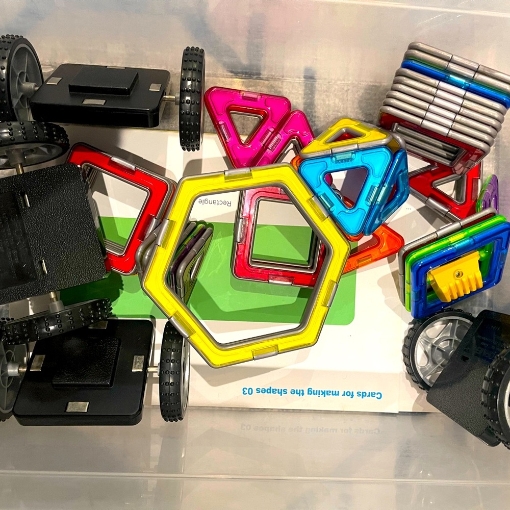 Mix and match dinosaur toys and magnetic truck building toy